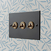 3 Gang Brass Dolly Switch Beeswax Bevelled Plate