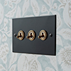 3 Gang Brass Dolly Switch Matt Black Bevelled Plate