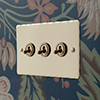 3 Gang Brass Dolly Switch Plain Ivory Hammered Plate