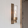 Raydon Wall Light in Antiqued Brass (Plain Glass)