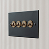 4 Gang Brass Dolly Switch Matt Black Bevelled Plate