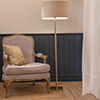 Porter Floor Lamp in Antiqued Brass