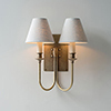 Double Station Wall Light in Antiqued Brass