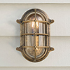 Bulkhead Outdoor Light in Antiqued Brass