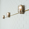 Bulkhead Outdoor Light in Antiqued Brass