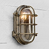 Bulkhead Outdoor Light in Antiqued Brass