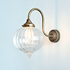 Mia Wall Light in Antiqued Brass