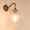 Ashley Fluted Wall Light with Carrick Arm in Antiqued Brass
