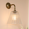 Ashley Fluted Wall Light with Brooke Arm in Antiqued Brass