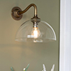 Emelia Wall Light with Carrick Arm in Antiqued Brass
