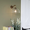 Emelia Wall Light with Carrick Arm in Antiqued Brass