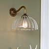 Emelia Fluted Wall Light with Carrick Arm in Antiqued Brass