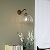 Emelia Fluted Wall Light with Carrick Arm in Antiqued Brass