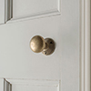 Rim Lock (Left) with Holkham Knob, Antiqued Brass