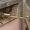 Newport Sprung Cabin Hook in Antiqued Brass