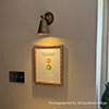 Single Curtis Spot Light in Antiqued Brass