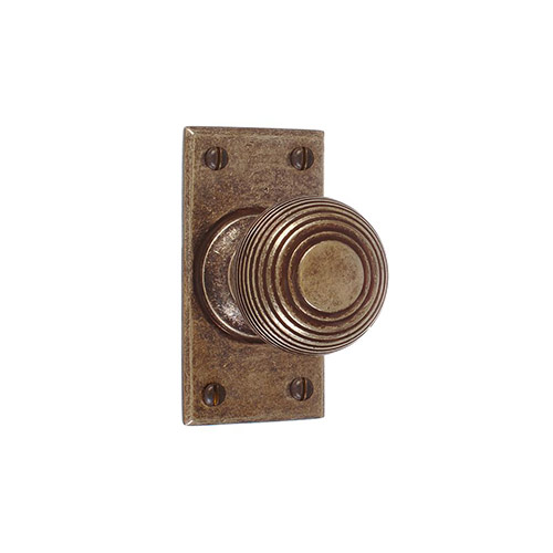 Reeded Door Knob, Bristol Short Plate, Antiqued Brass