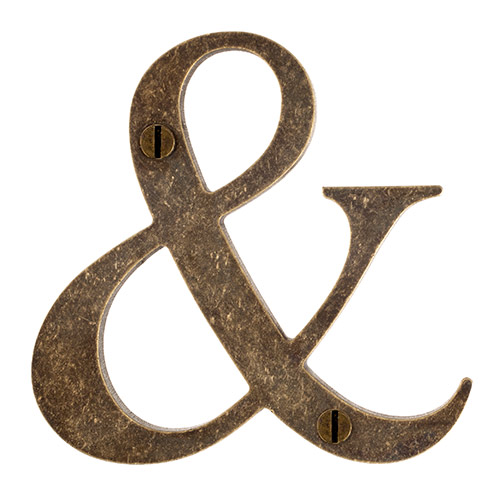 Character & in Antiqued Brass