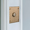 Square Door Bell Cover in Antiqued Brass with Ceramic Bell Push