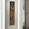 2 Gang Brass Dolly Architrave Switch Antiqued