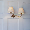 Double Carrick Wall Light in Antiqued Brass