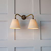 Double Carrick Wall Light in Antiqued Brass