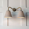 Double Carrick Wall Light in Antiqued Brass