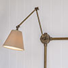 Articulated Conduit Wall Light in Antiqued Brass