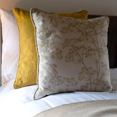 Piped cushion cover in Ochre Waterford Linen