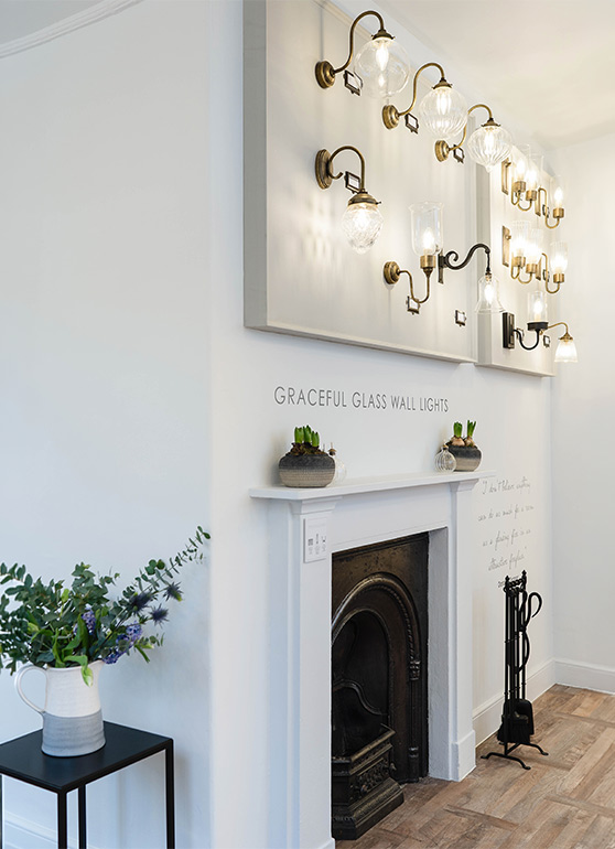 Showroom wall lights above a fireplace in Bath