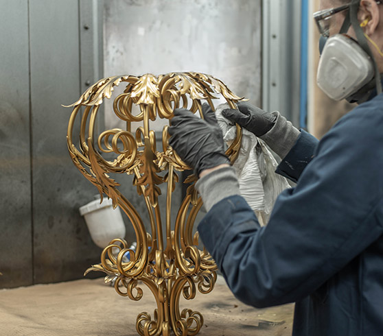 Carrie painting the Montgomery in old gold