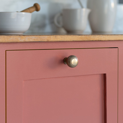 Reeded knob on Red Ochre cabinet